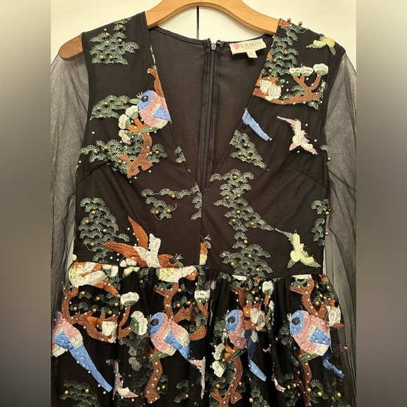 Vibrant beaded dress with a nature scene and she arms - Picture 4 of 11